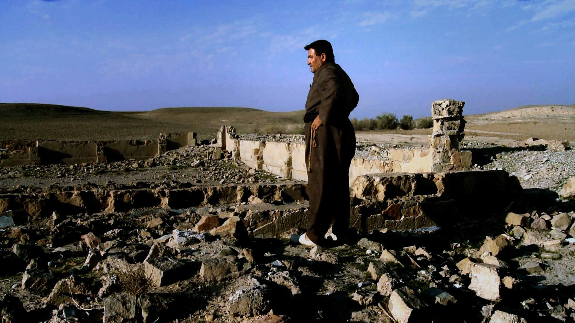 OSMAN ALI AZIZ shows us the remains of his nephew Teimour's home. Teimour was a young Kurdish boy from Kulajo village who survived a mass execution in 1988 aged 11. He was rescued in the southern deserts by a bedouin family but most of his family died during Anfal.
