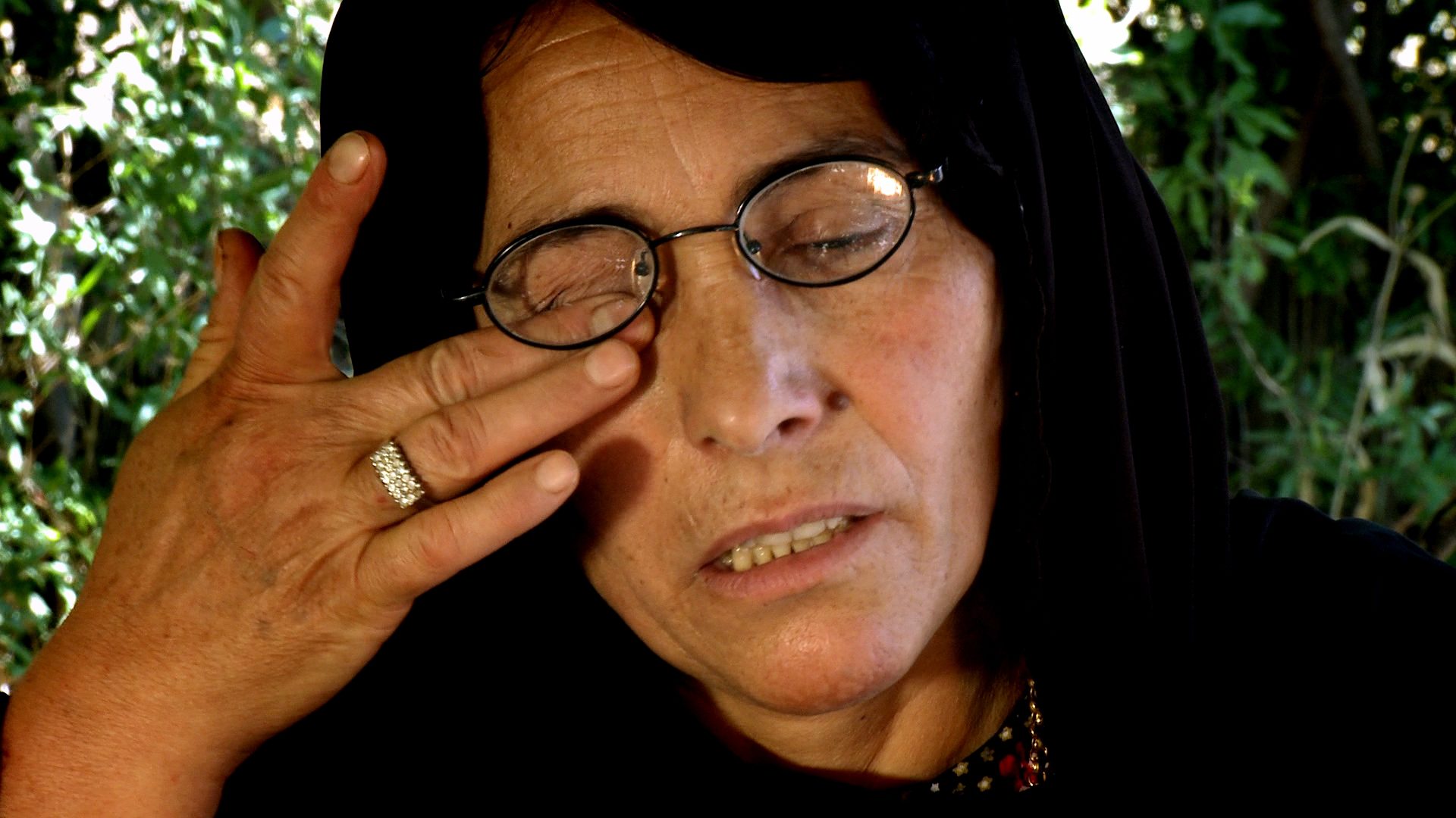 Although vomiting and unable to see, NAJIBA KHADIIR AHMED, escaped into the mountains on a donkey and sheltered in a cave. With her son hungry and in pain beside her, they stayed there until nightfall. Villagers then found them both and brought them to a hospital in Raniya. The next day, they were both imprisoned in Erbil.