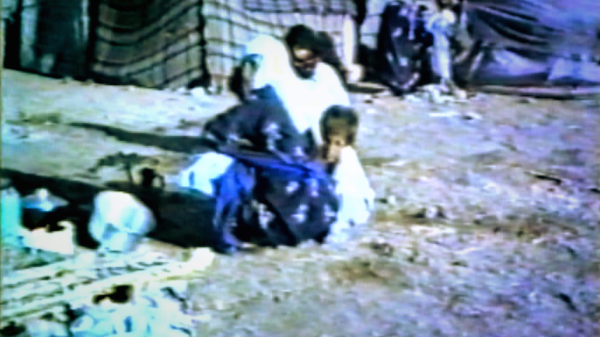 The Anfal survivors in the Baharka internment camp were the mothers, wives and children of Kurdish men executed by the Iraqi authorities. When they arrived they were supported by the local people of Erbil who brought supplies to the camp, but food and water were still in short supply and many of their children died of starvation.